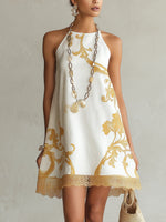 Héloïse | Vestido mini de encaje blanco con motivos dorados