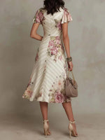 Alba | Vestido midi cruzado y fruncido con estampado floral