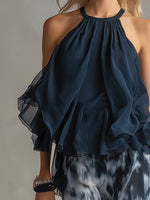 Chloé | Conjunto elegante con top de espalda descubierta azul marino y pantalón ancho estampado