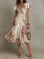 Alba | Vestido midi cruzado y fruncido con estampado floral