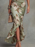 Anne | Vestido largo asimétrico de satén verde con escote en V, mangas abullonadas y estampado floral