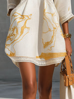 Aliénor | Vestido mini de encaje de croché marfil con motivos dorados y escote en V