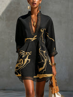 Léonie | Vestido mini de encaje de croché negro con motivos dorados y escote en V