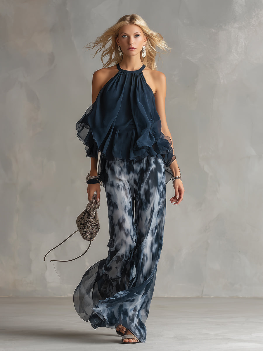 Chloé | Conjunto elegante con top de espalda descubierta azul marino y pantalón ancho estampado