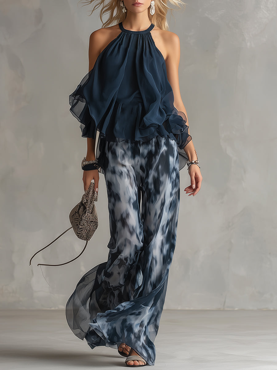 Chloé | Conjunto elegante con top de espalda descubierta azul marino y pantalón ancho estampado