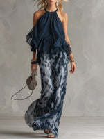 Chloé | Conjunto elegante con top de espalda descubierta azul marino y pantalón ancho estampado