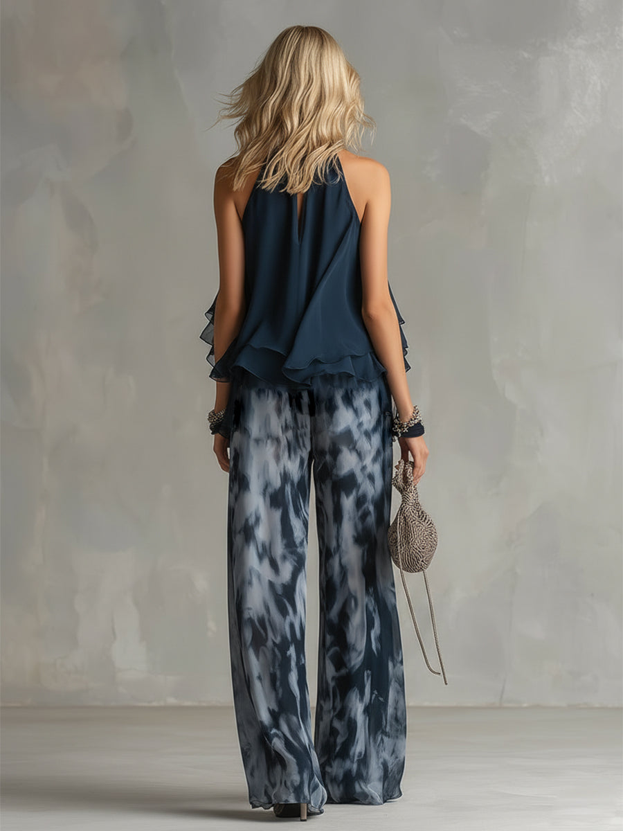 Chloé | Conjunto elegante con top de espalda descubierta azul marino y pantalón ancho estampado