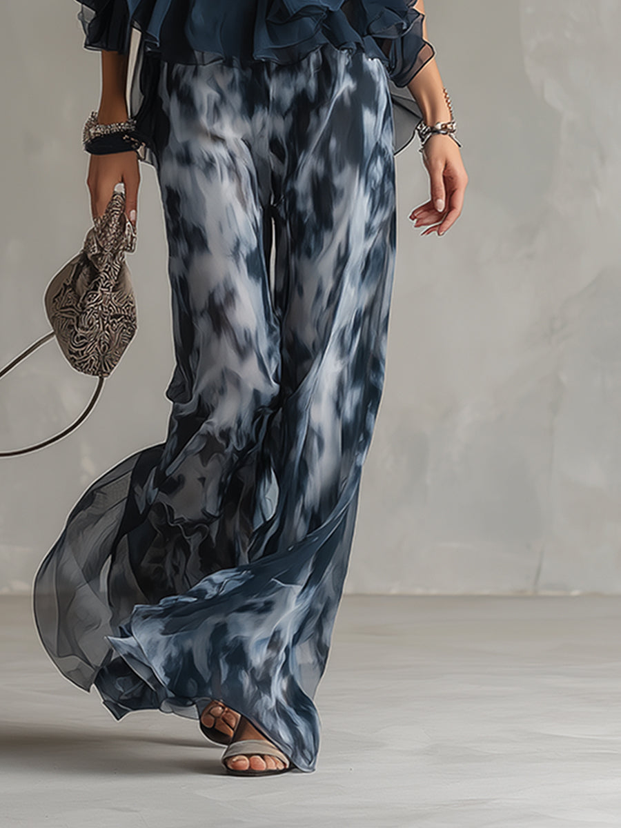 Chloé | Conjunto elegante con top de espalda descubierta azul marino y pantalón ancho estampado